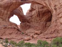Dad climbing Double Arch for a photo - Arches National Park (Utah, USA)