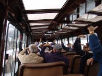 People waving backwards out the coach - Jasper National Park (Alberta, Canada)