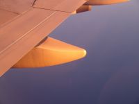 Aircraft wing in sunrise - Pacific Ocean (No State, International)